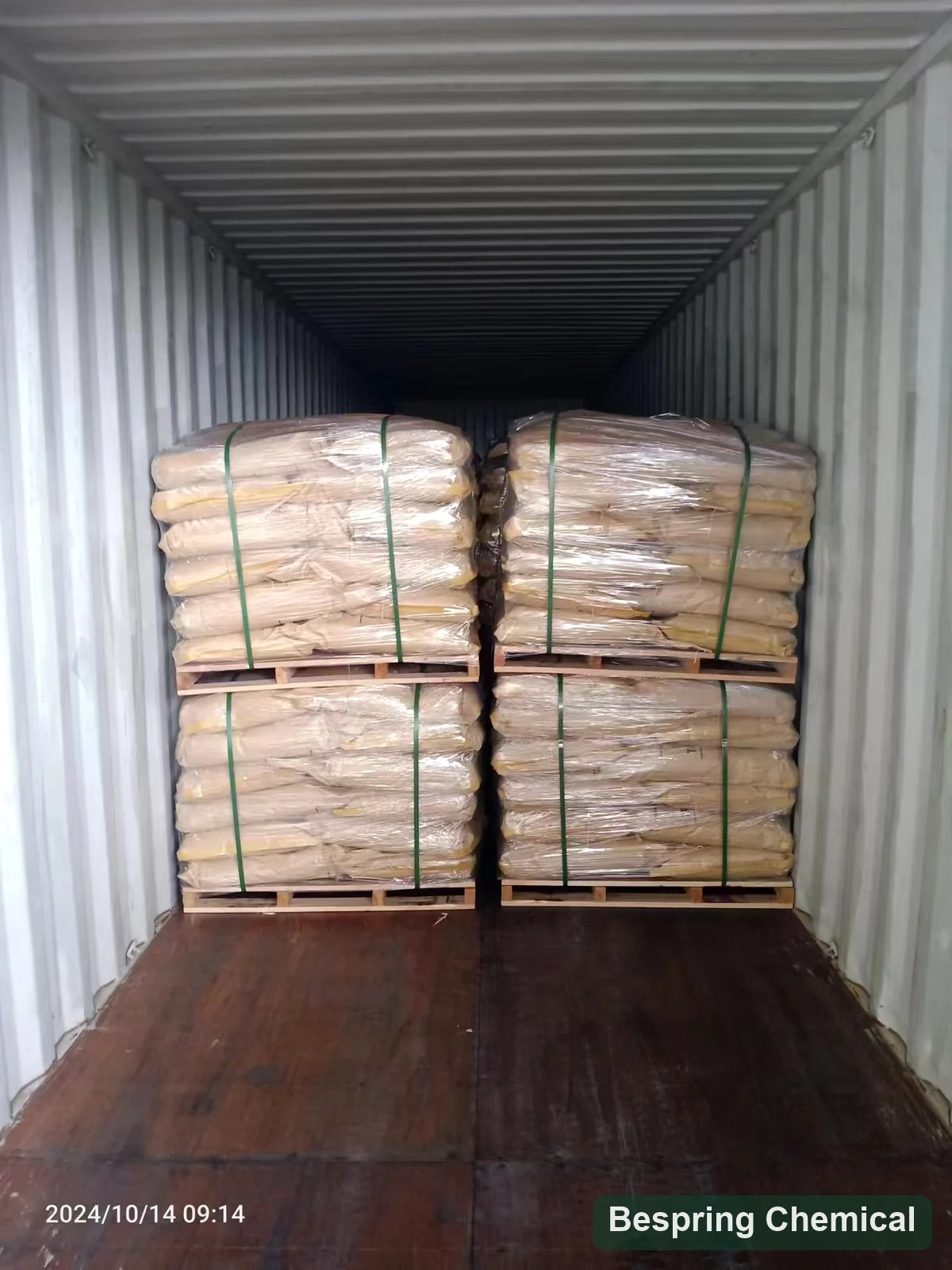 Palletized bagged goods in a shipping container, photographed in October 2024