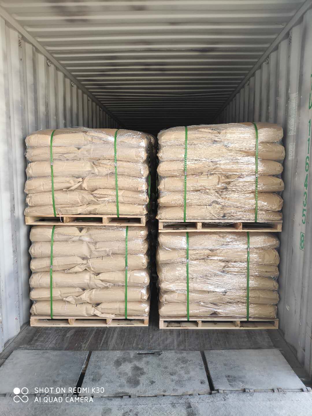 Palletized bags loaded in a container for food grade citric acid export
