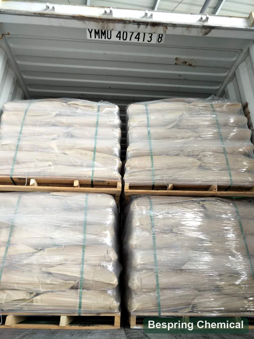 Reference photo of palletized bagged material in a shipping container