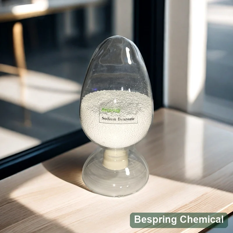 Food grade sodium benzoate granule sample in a clear display vessel